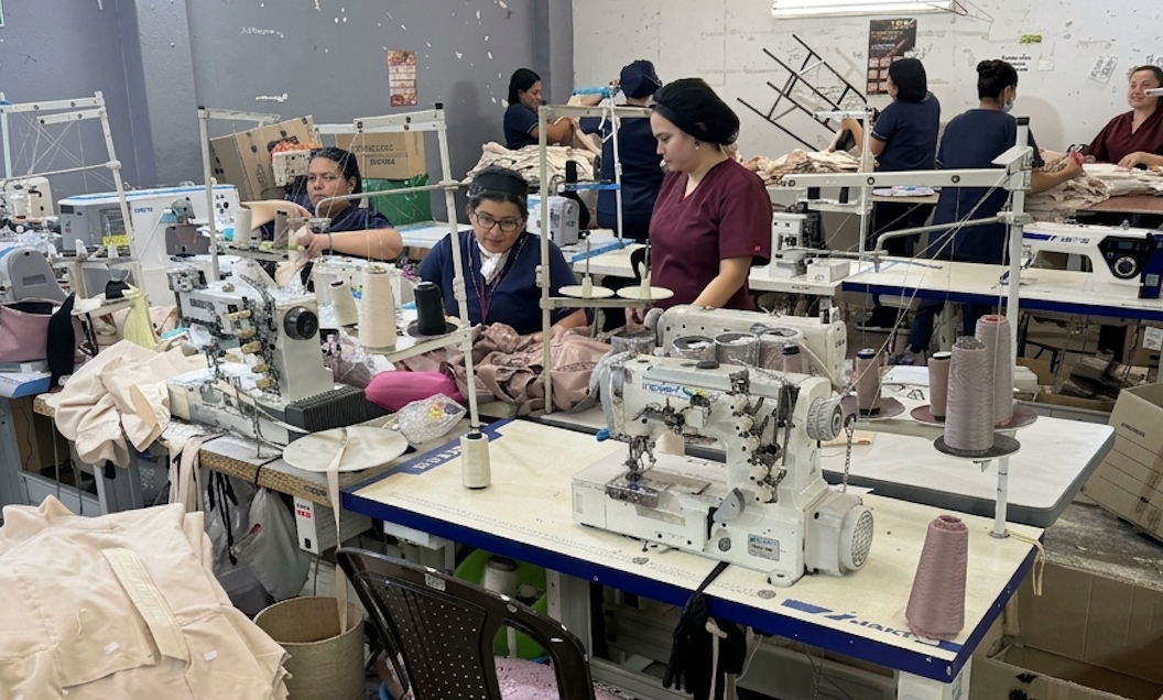 Seamstresses assembling Colombian shapewear at the Noga Curves factory in Bogotá, using industrial overlock machines
